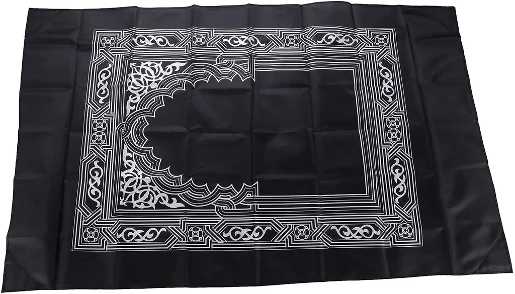 Tapis de prière de voyage déplié, motif mihrab argenté sur fond noir