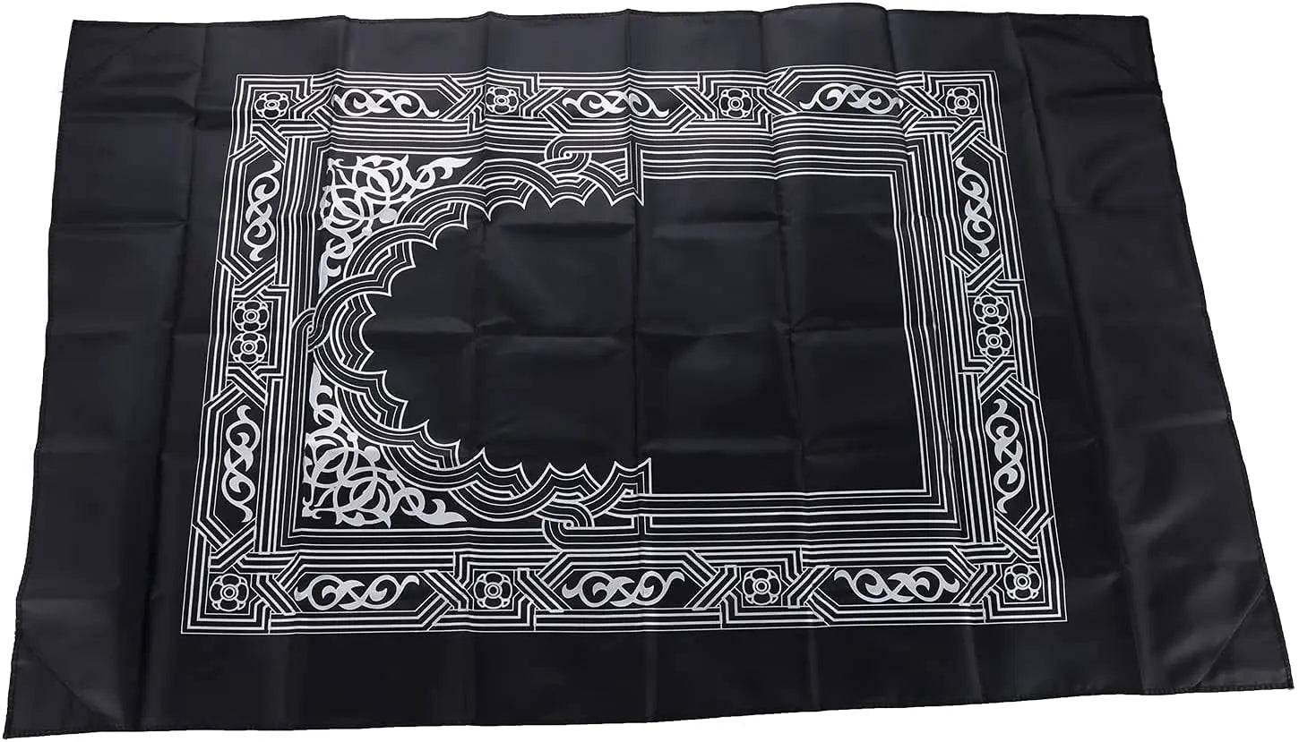 Tapis de prière de voyage déplié, motif mihrab argenté sur fond noir