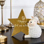 Mouton en résine adossé à une étoile dorée — décoration de l'Aïd al-Adha